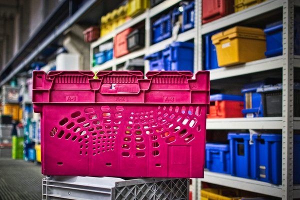 Pink nestable, plastic tote produced by Utz